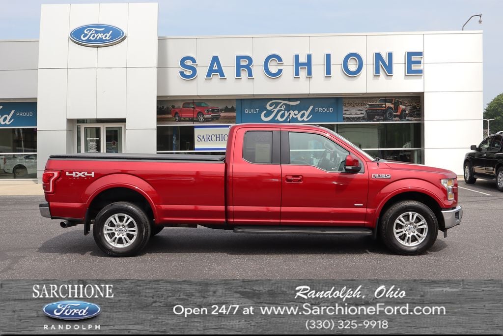 2016 Ford F-150 Lariat in Ruby Red Metallic Tinted Clearcoat — front three-quarter view